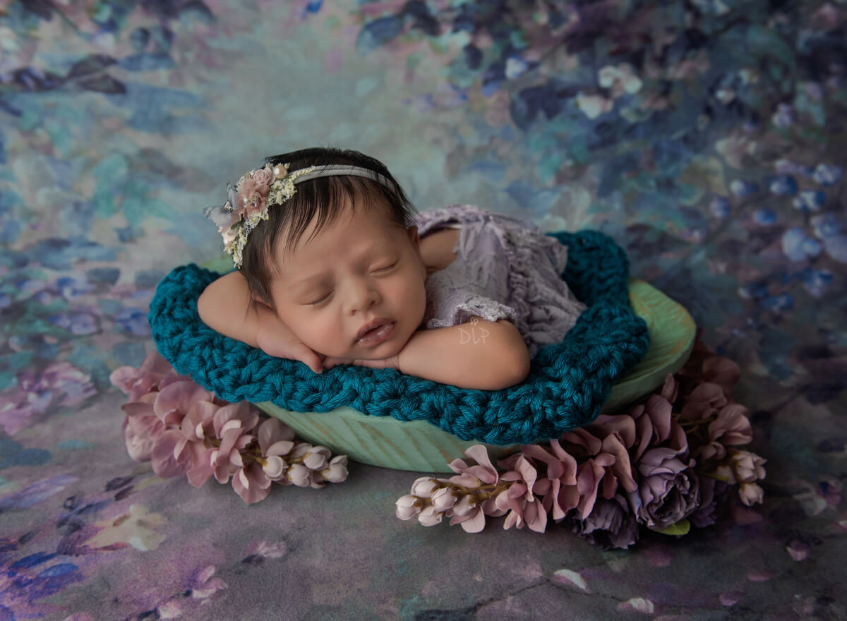 Special by Austin Newborn Photographer baby girl in purple outfit