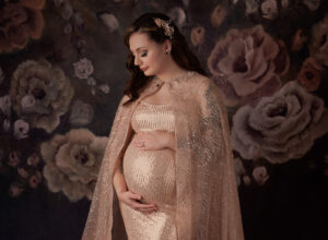 Austin Maternity Photographer expecting mom posing in pink formal gown