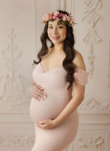 Austin Maternity Photographer expecting mom posing in pink gown