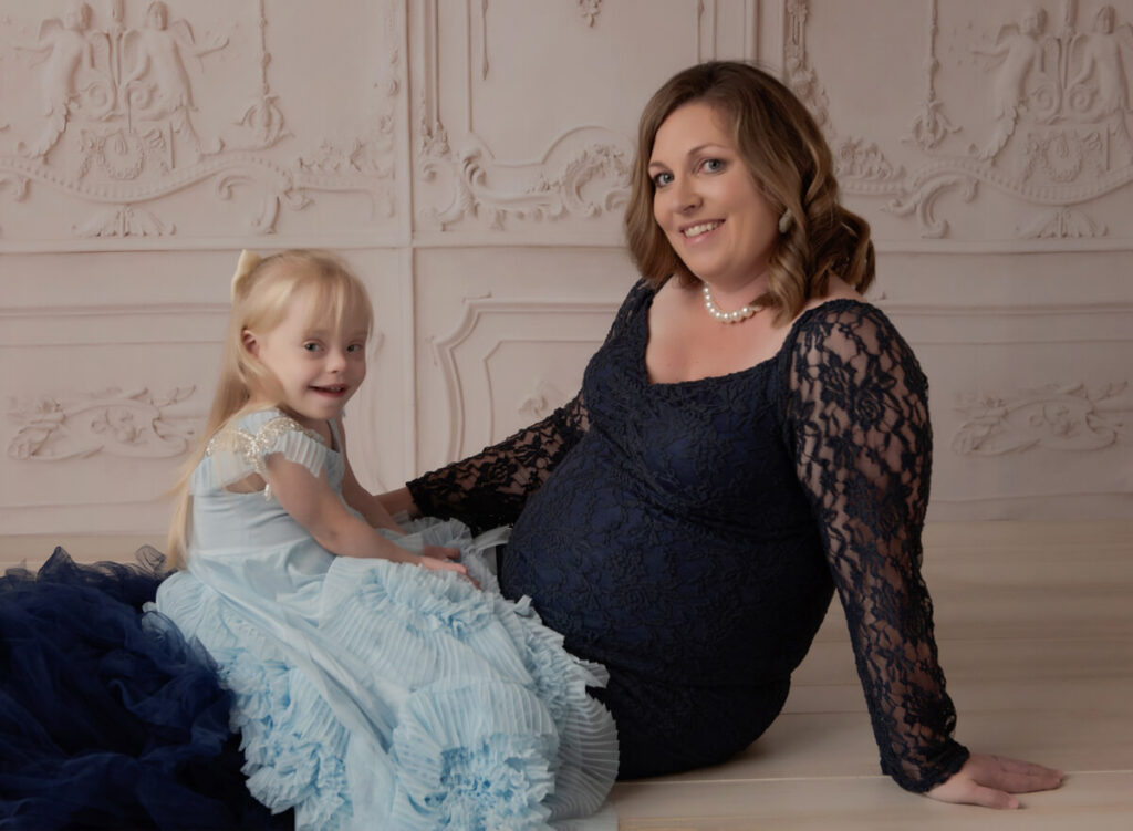 Mom and daughter posing in Austin baby boutique clothing