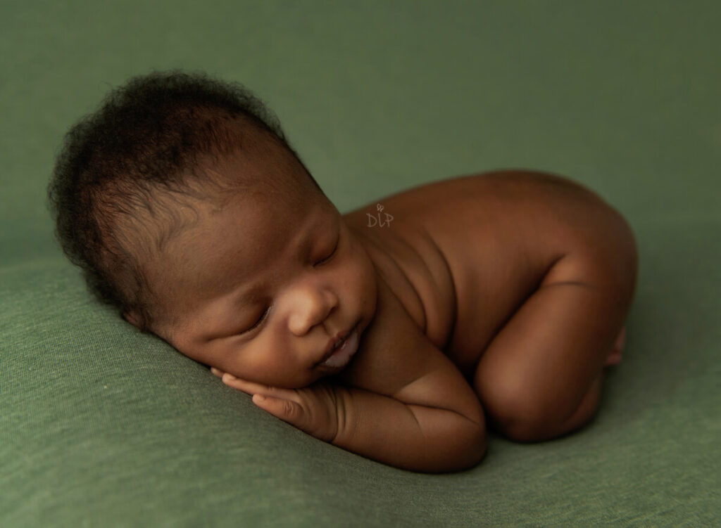 Austin Newborn Photographer baby boy on green fabric