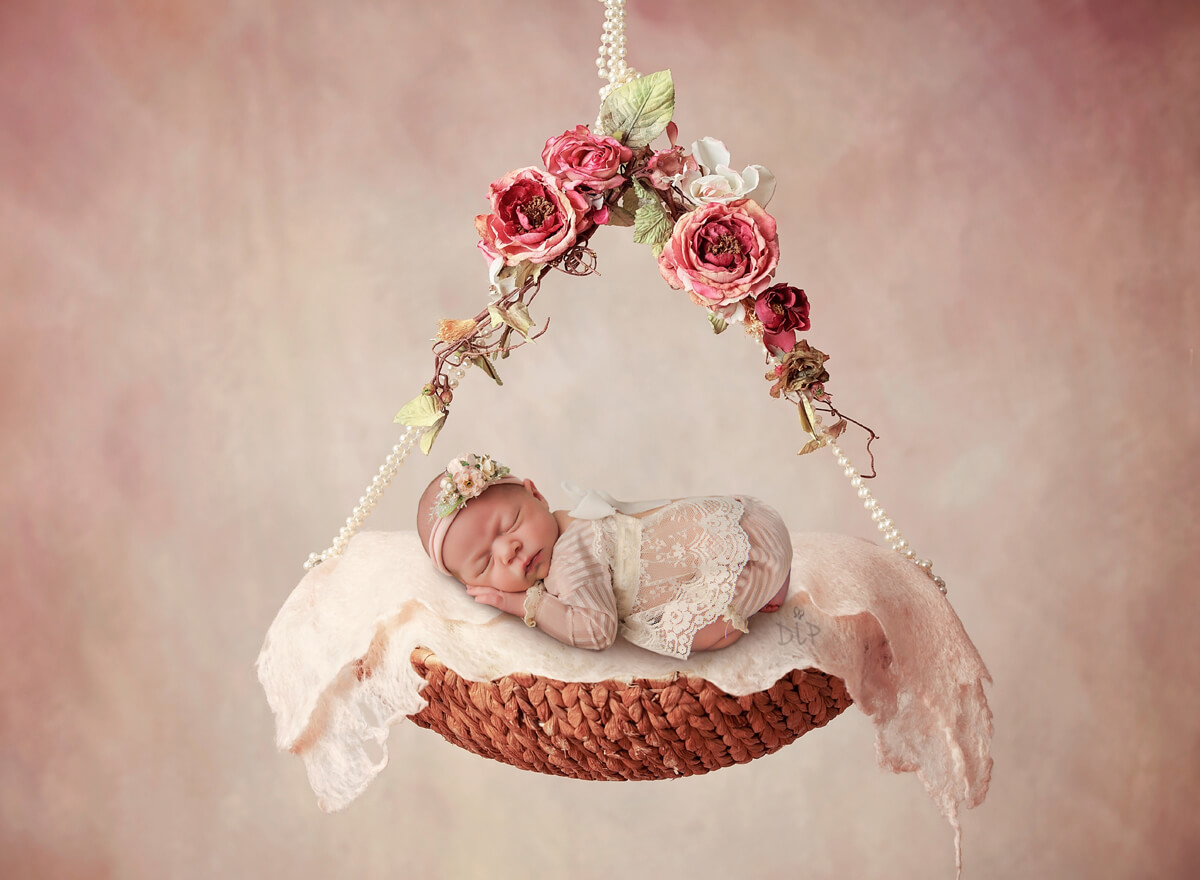 Austin Newborn Photographer baby girl in pink on floral swing