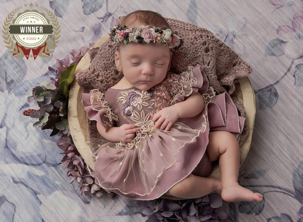 Austin Newborn Photographer baby girl in mauve outfit in cream bowl with flowers